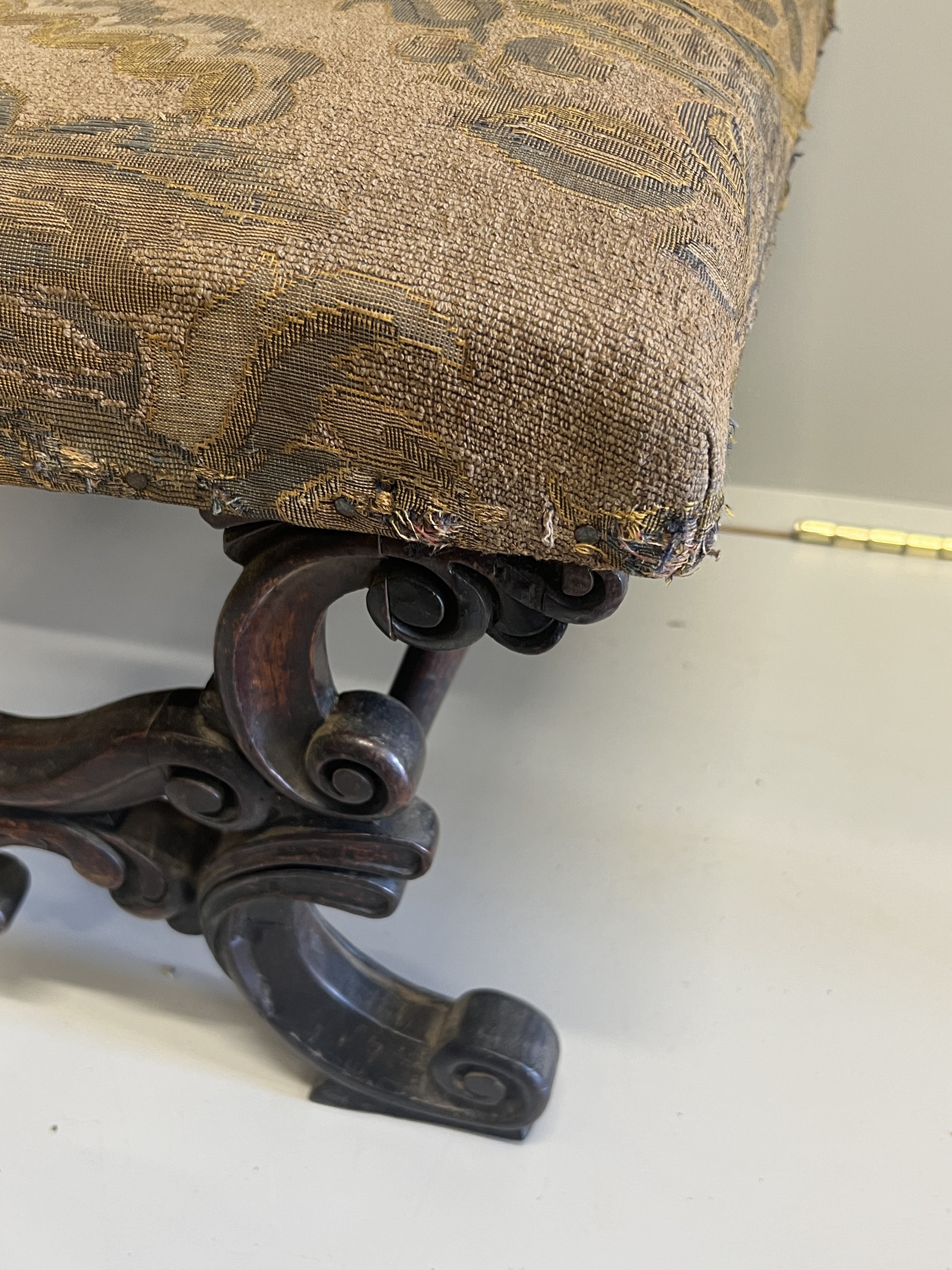 A Victorian carved and upholstered rectangular 'X' framed oak dressing stool, width 56cm, depth 45cm, height 36cm